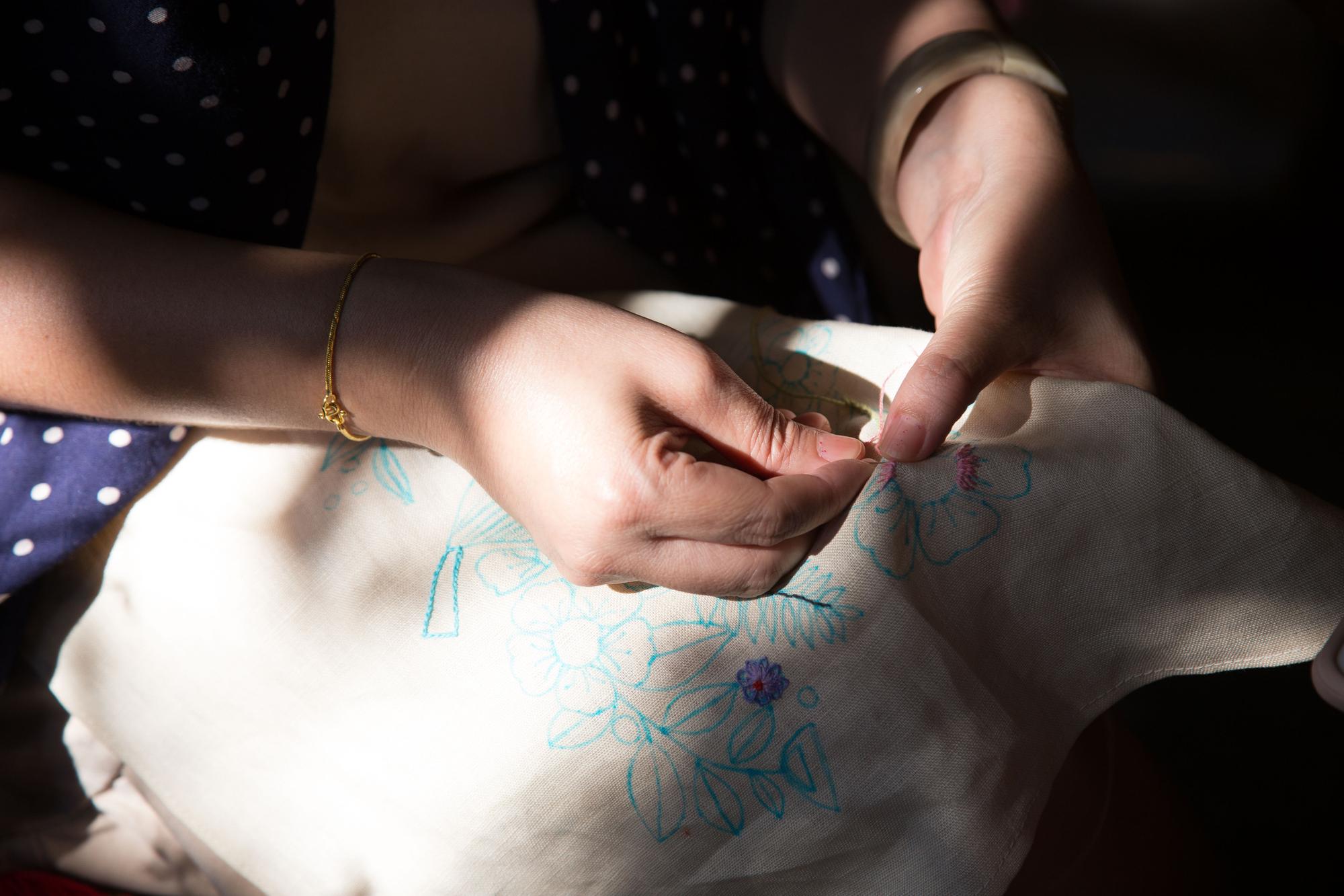 Close-up of hand embroidery on linen
