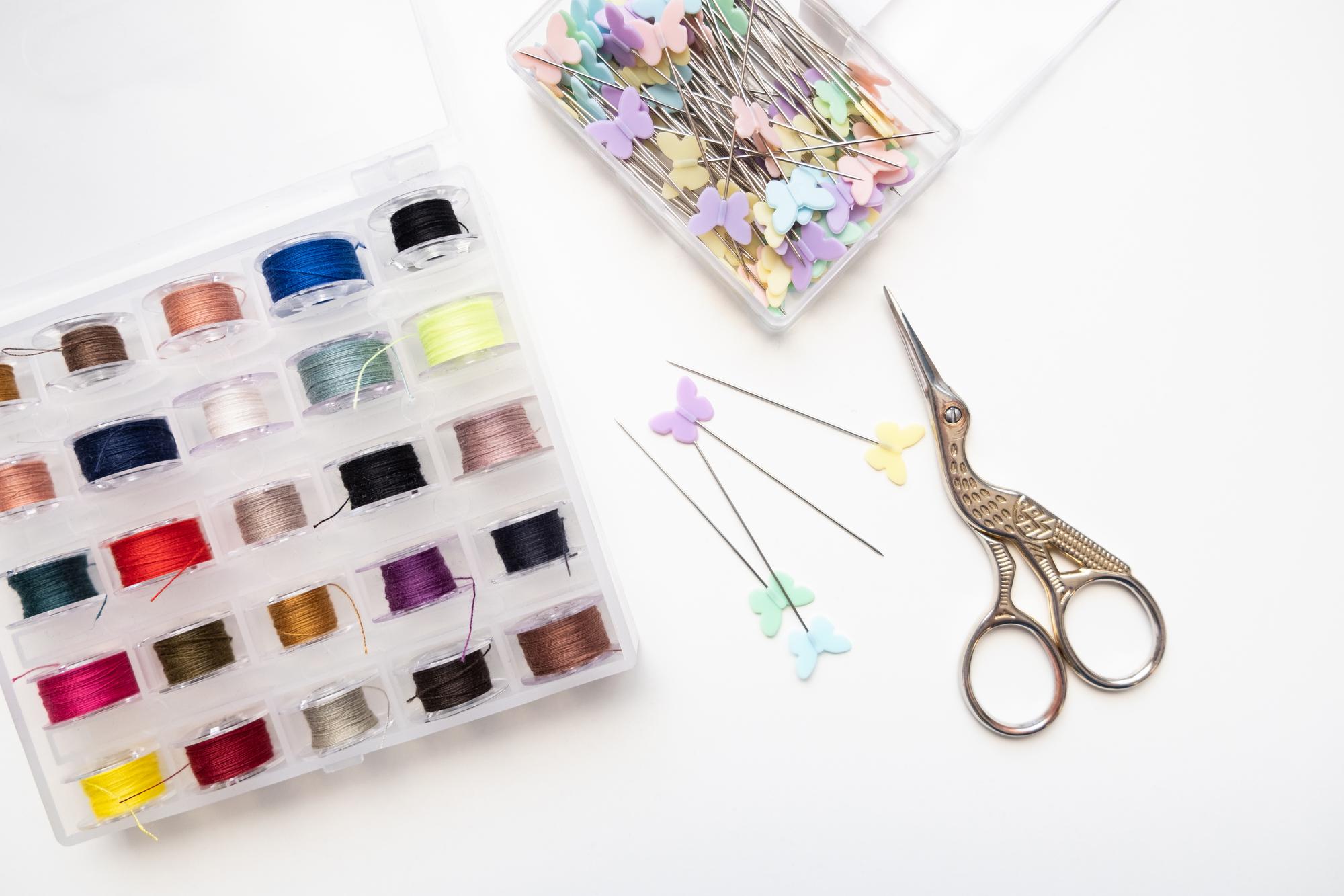 Collection of small embroidered samples on table